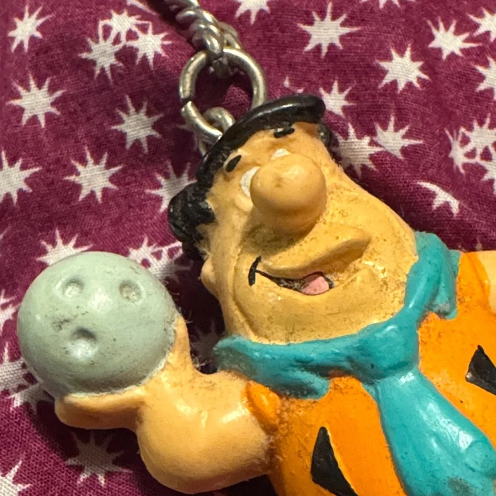 Fred Flintstone Cartoon Character Keychain with Orange and Blue Accents